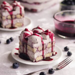 Light and airy blueberry-soaked ladyfingers and luscious blueberry mascarpone cream filling are layered together in this blueberry-licious rendition of a classic Italian dessert!