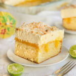 Moist and fluffy coconut cake, homemade lime curd, creamy coconutty topping, and toasted flakes of coconut--this Coconut Lime Poke Cake is the perfect dessert to welcome spring OR summer!