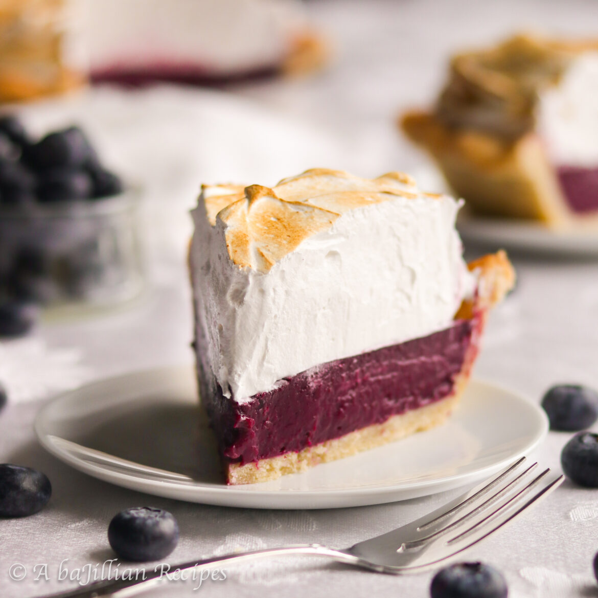 Smooth and velvety blueberry filling nestled in a golden flakey crust and crowned with the fluffiest melt-in-your-mouth Swiss meringue!