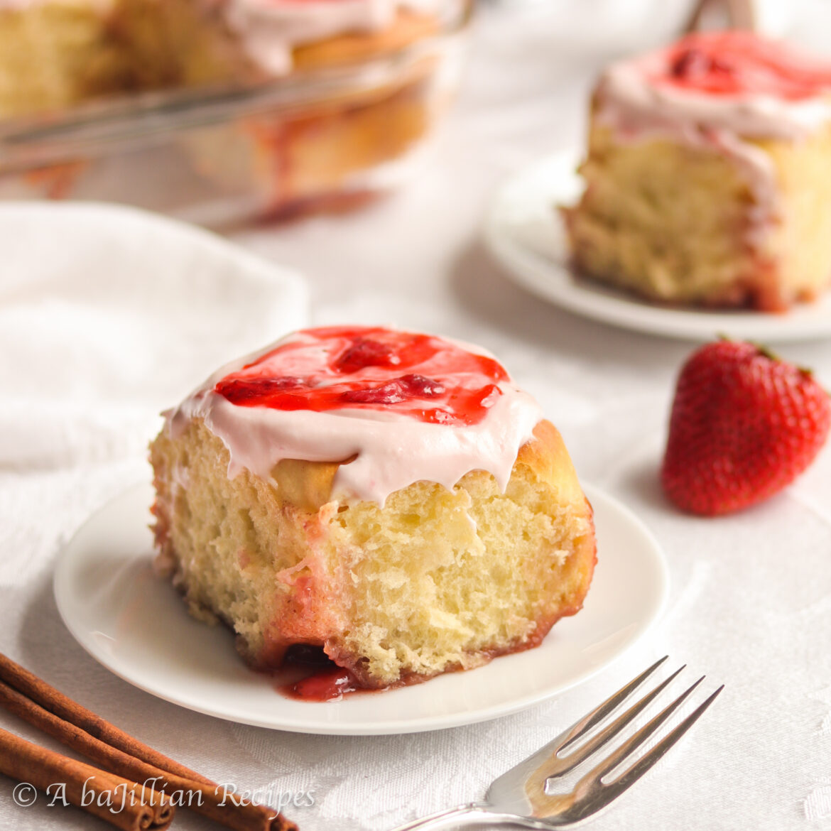Supremely soft and pillowy cinnamon rolls swirled with both brown sugary cinnamon filling and fresh strawberry filling, and slathered in a luscious strawberry cream cheese frosting!