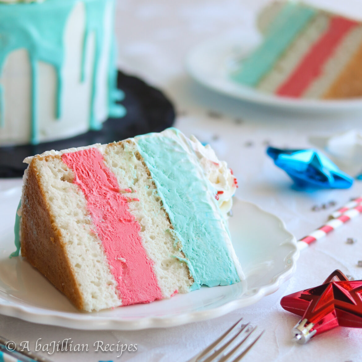 Layers of moist vanilla cake between unbelievably creamy layers of white chocolate cheesecake ice cream, iced with whipped cream frosting and cloaked in a dreamy white chocolate ganache. The perfect patriotic treat to celebrate the 4th of July!
