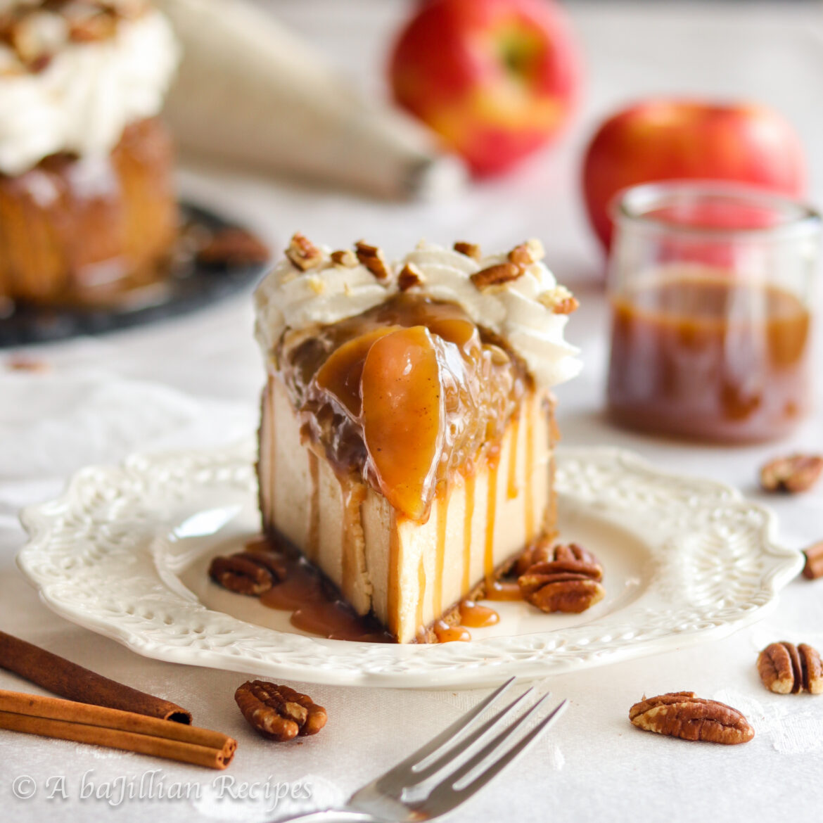 This Caramel Apple Cheesecake is infused with rich caramel, topped with tender cinnamon-spiced apple filling,  generously drizzled with silky caramel and nestled in a buttery Biscoff cookie crust!