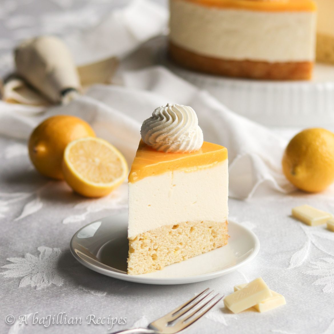 Lemon White Chocolate Mousse Torte | A baJillian Recipes Moist and tender vanilla cake, creamy white chocolate mousse, and lusciously tart lemon curd make this Lemon White Chocolate Mousse Torte a stunner for both the eyes and the tastebuds!