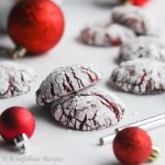 These Red Velvet Crinkle Cookies are a delicious twist on the classic chocolate crinkle! They're soft-baked and exquisitely fudgy in the center, loaded with melty chocolate chips, and dressed in a dazzling coat of powdered sugar!