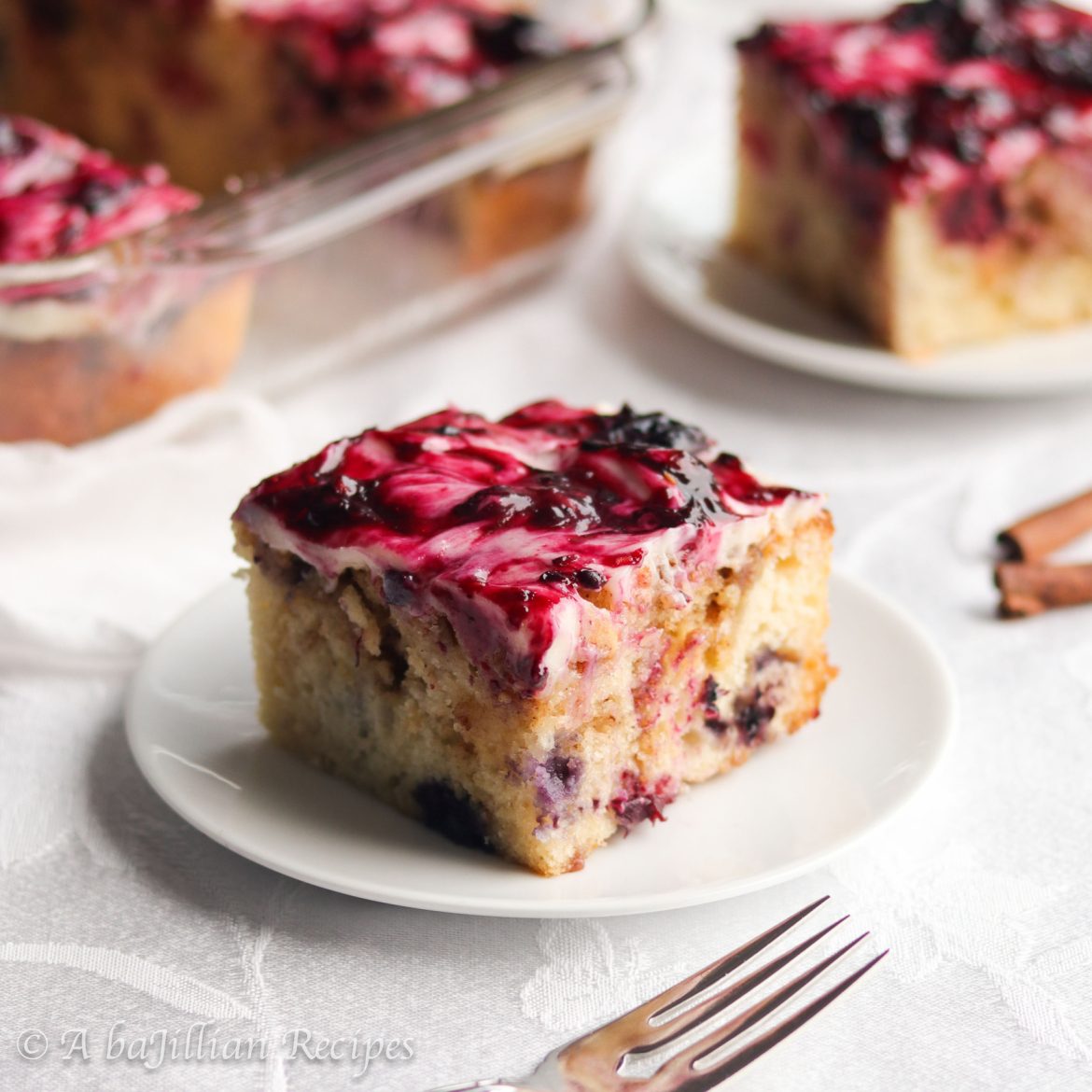 Supremely moist and fluffy cake swirled with brown sugar-cinnamon filling, loaded with juicy berries, and slathered in luscious mixed berry cream cheese frosting!