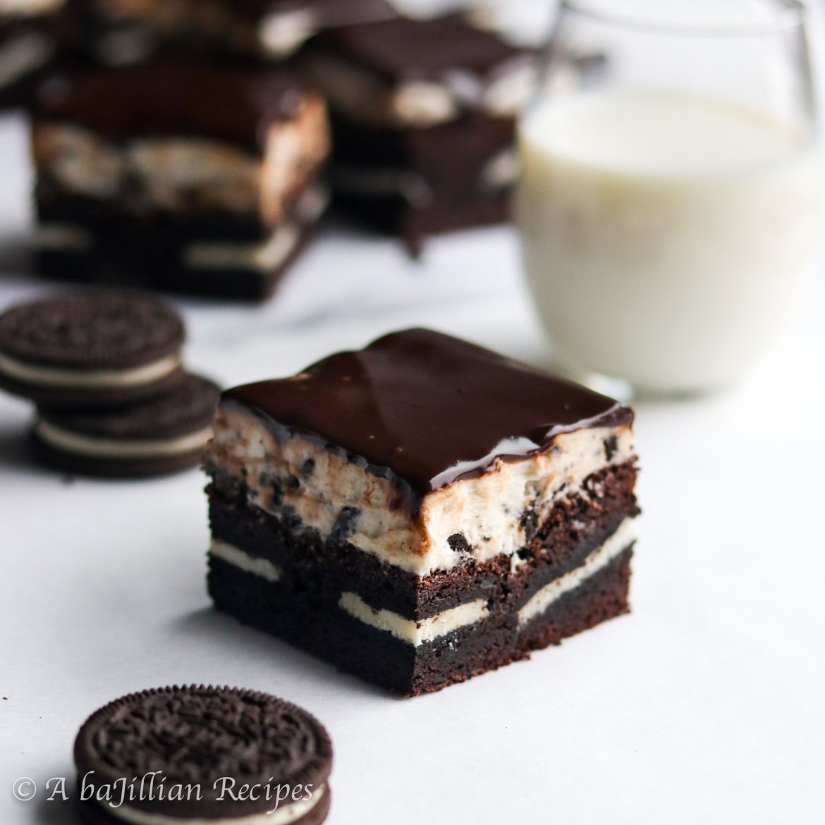 Indulgently fudgy brownies baked with a layer of Oreos, frosted with Oreo buttercream, and glazed in a silky smooth cloak of chocolate ganache!