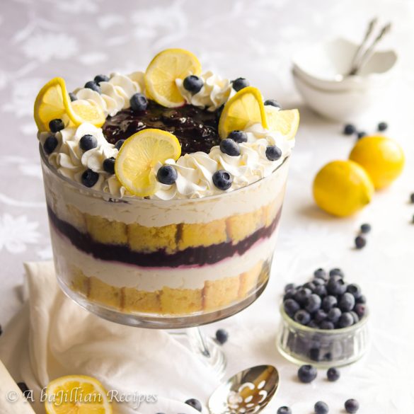Tantalizing layers of moist lemon cake, fresh blueberry sauce, and fluffy lemon cheesecake filling!