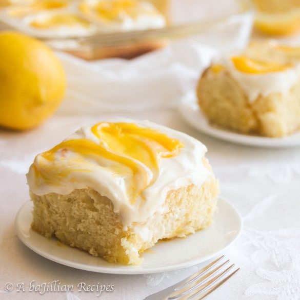 Fluffy and exquisitely tender, these Lemon Sweet Rolls are swirled with both lemon sugar AND luscious lemon curd, and generously smothered in lemon cream cheese frosting!