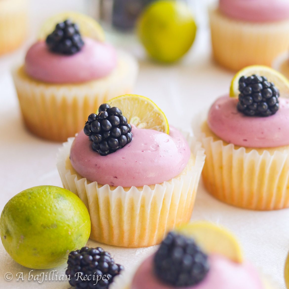 Fluffy key lime cupcakes topped with tart and tangy blackberry cream cheese frosting!