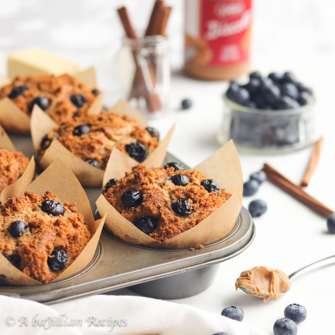 Supremely fluffy muffins infused with the warm richness of Biscoff cookie butter and packed with juicy blueberries!