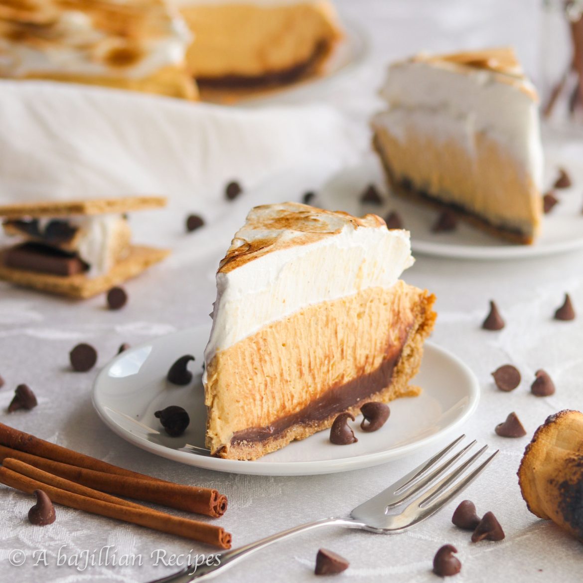 Fluffy and incredibly creamy pumpkin filling, smooth milk chocolate ganache, and toasted marshmallow fluff all perfectly nestled in a crisp graham cracker crust!