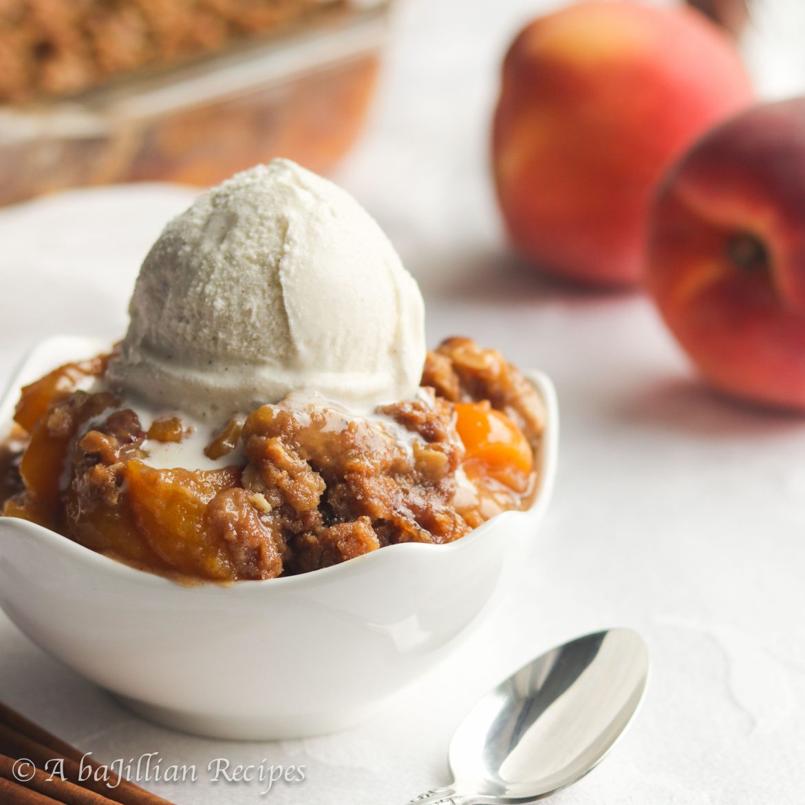 Fresh and juicy peaches baked underneath a generous layer of buttery, brown sugary, toasted Biscoff streusel! Add a scoop of creamy vanilla ice cream, and you have the most perfect Peach Crisp ever!