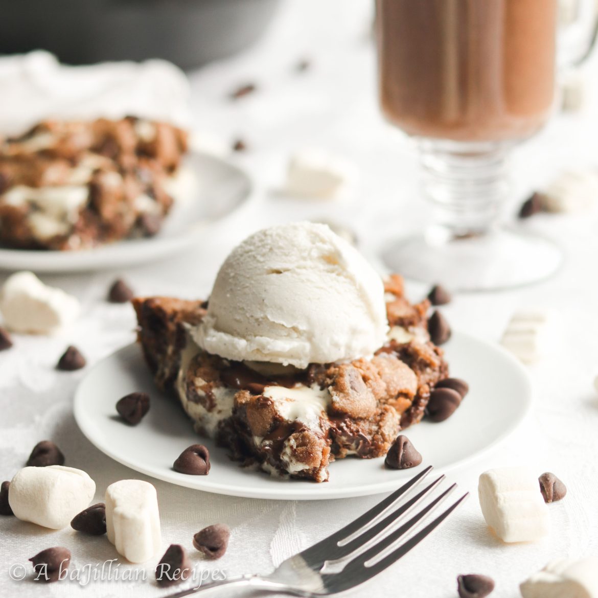 Warm and deliciously doughy, this Hot Chocolate Pizookie is brimming with gooey marshmallows, melty chocolate chips, and crisp mini marshmallow bits!