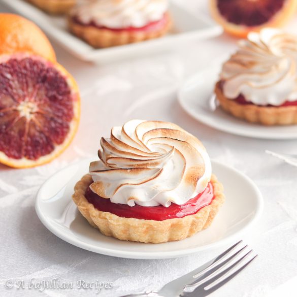 Lusciously tart and sweet, these Blood Orange Meringue Tarts feature delicious blood orange curd and toasted Italian meringue in a buttery flakey crust!