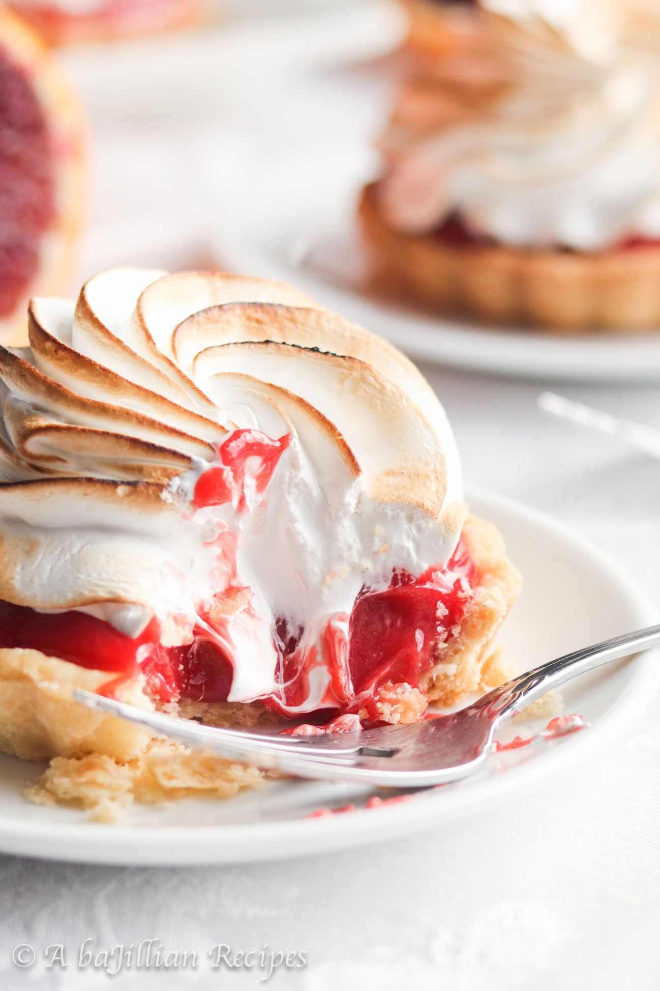 Lusciously tart and sweet, these Blood Orange Meringue Tarts feature delicious blood orange curd and toasted Italian meringue in a buttery flakey crust!