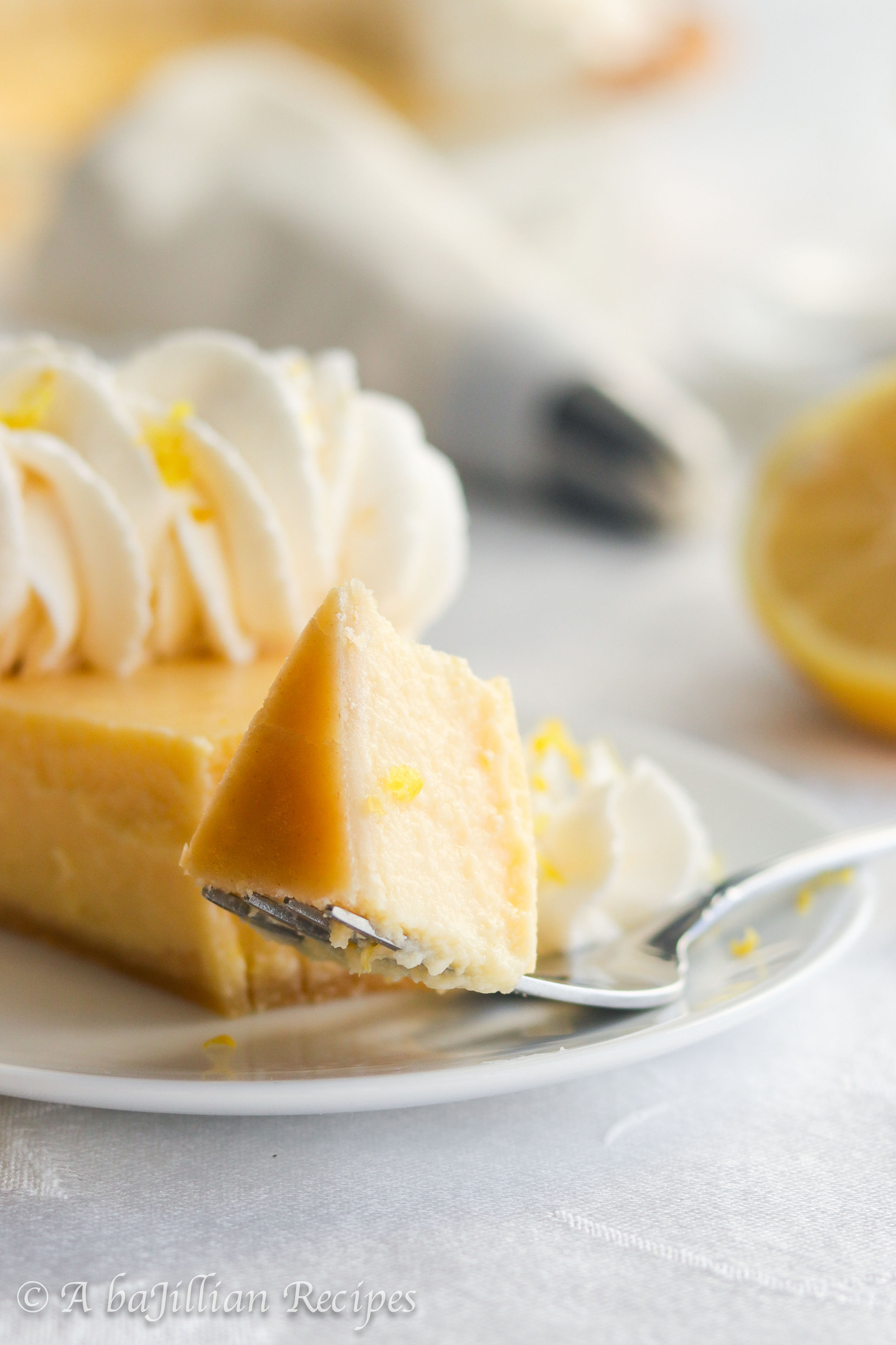 Smooth and creamy lemon filling nestled in a golden flaky pastry crust and crowned with a fluffy border of lemon-kissed whipped cream.