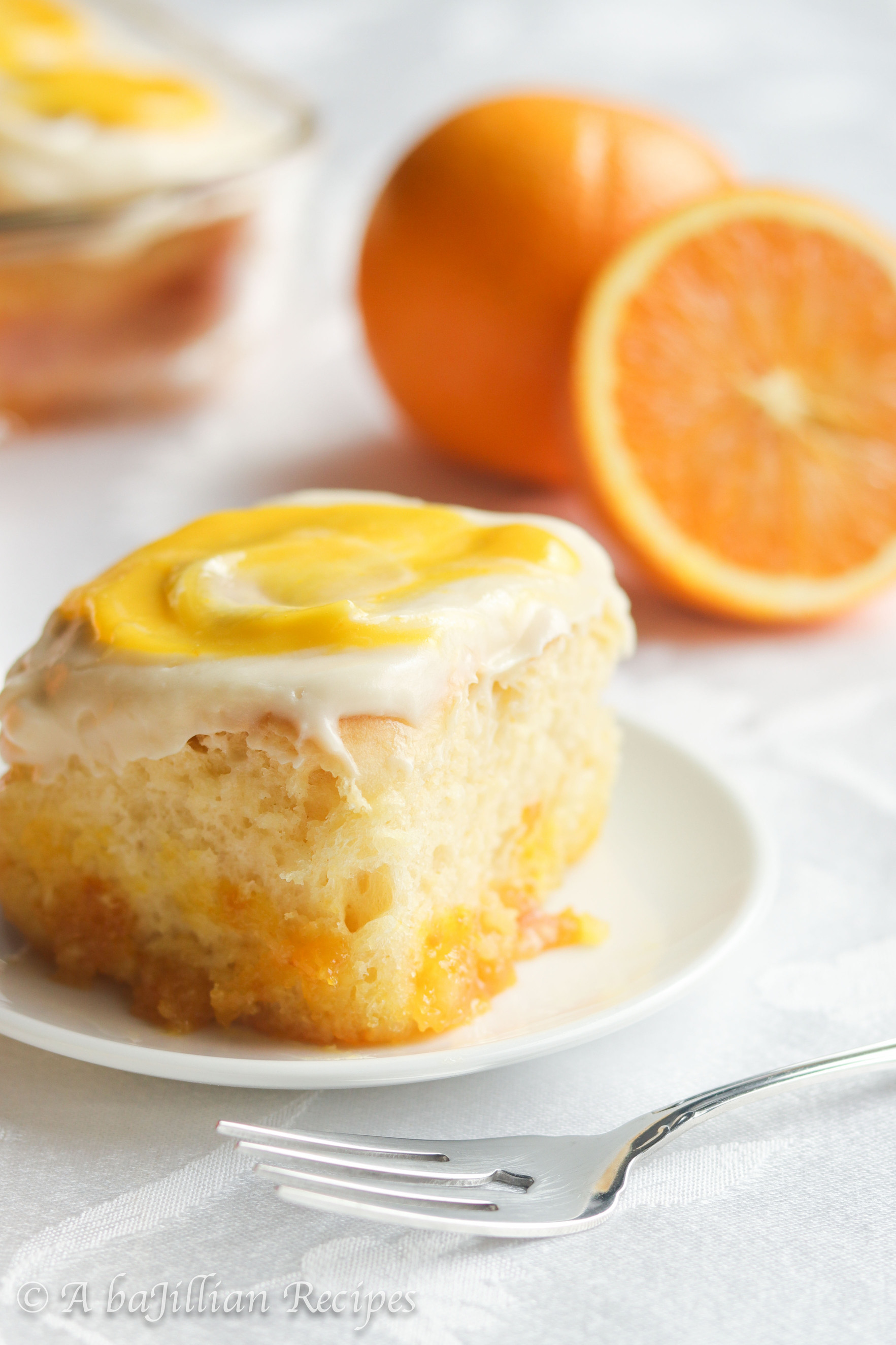 Incredibly soft and fluffy, these Orange Creamsicle Rolls are swirled with zesty citrus sugar filling and luscious orange curd, and slathered in tangy orange cream cheese frosting!