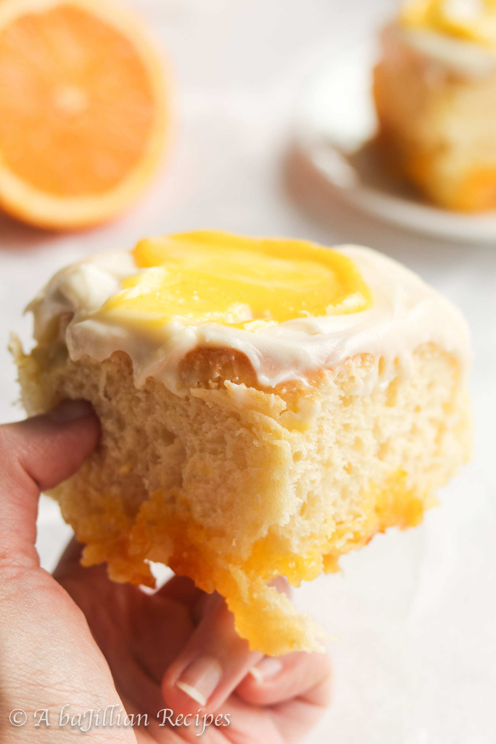 Incredibly soft and fluffy, these Orange Creamsicle Rolls are swirled with zesty citrus sugar filling and luscious orange curd, and slathered in tangy orange cream cheese frosting!