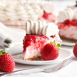 Light and fluffy cream filling infused with the natural sweetness of fresh strawberries, nestled in a toasty graham cracker crust, and topped with homemade strawberry sauce!