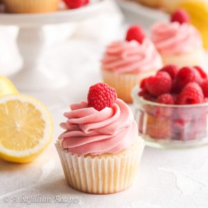 Moist and fluffy lemon cupcakes filled with fresh raspberry filling and crowned with creamy raspberry buttercream frosting!