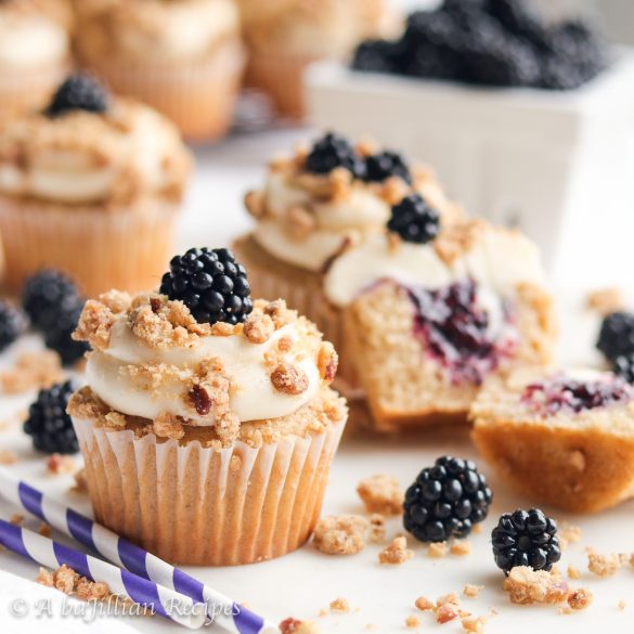 Soft and fluffy cinnamon-spiced cupcakes stuffed with fresh blackberry filling, topped with silky cream cheese frosting and brown sugary oat crumble!
