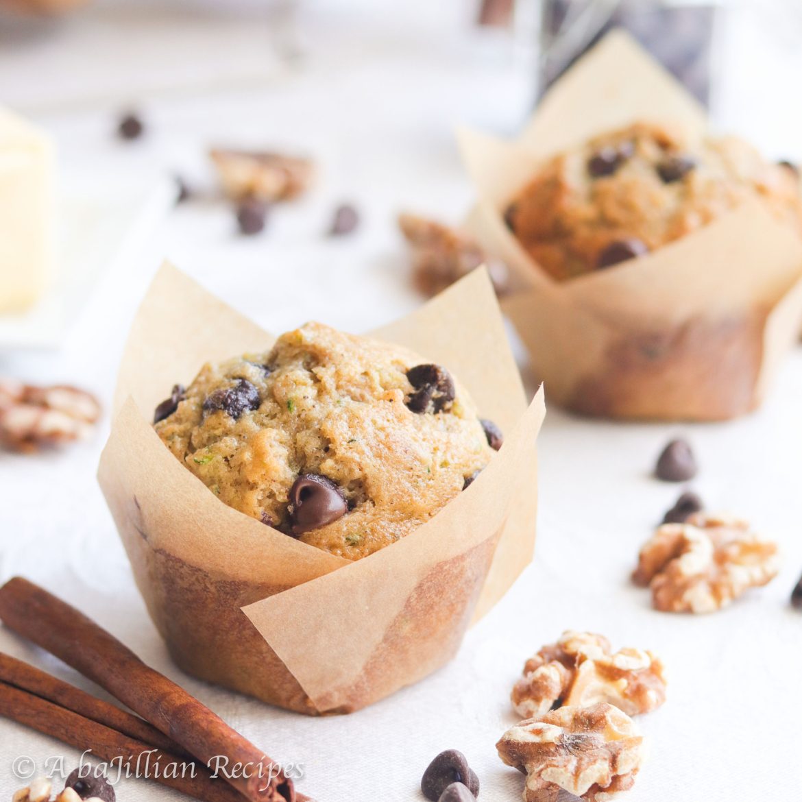 Soft, fluffy, and perfectly moist, these zucchini muffins are brimming with melty chocolate chips and crunchy toasted walnuts!