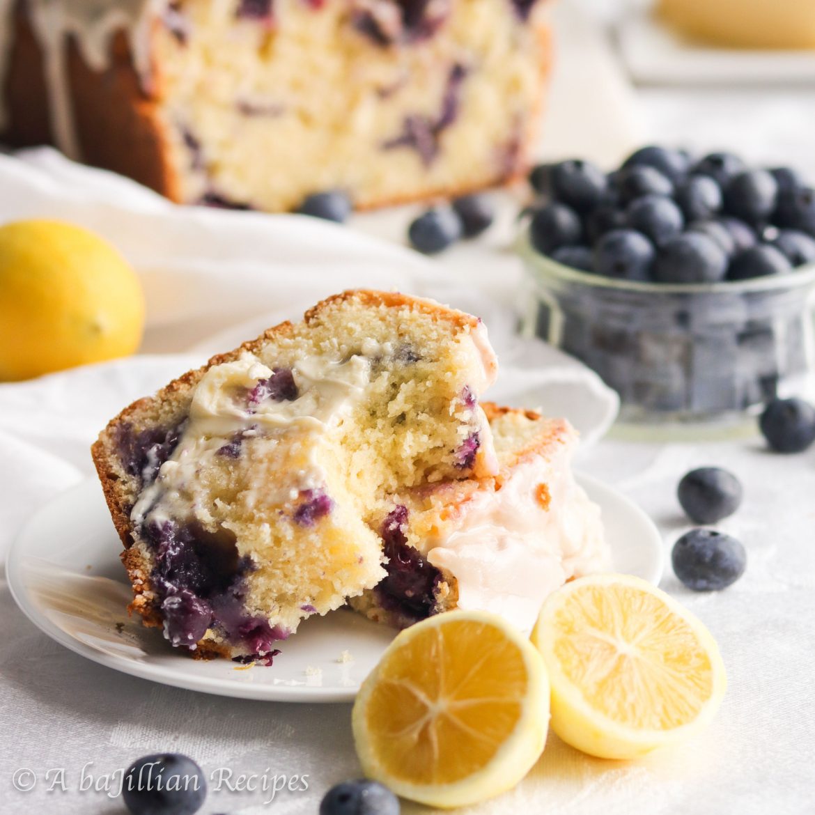 This Lemon Blueberry Bread bakes up soft, tender, and exquisitely moist. It's brimming with juicy blueberries and finished with silky smooth lemon icing!