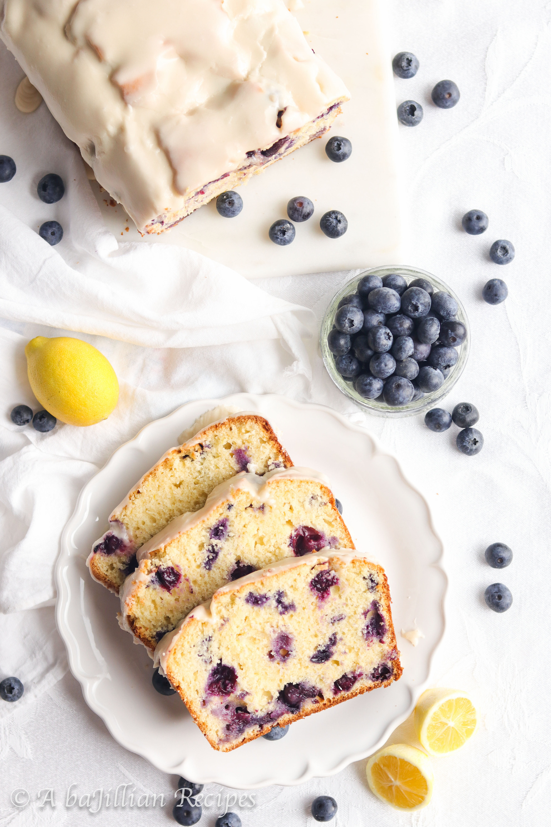 This Lemon Blueberry Bread bakes up soft, tender, and exquisitely moist. It's brimming with juicy blueberries and finished with silky smooth lemon icing!
