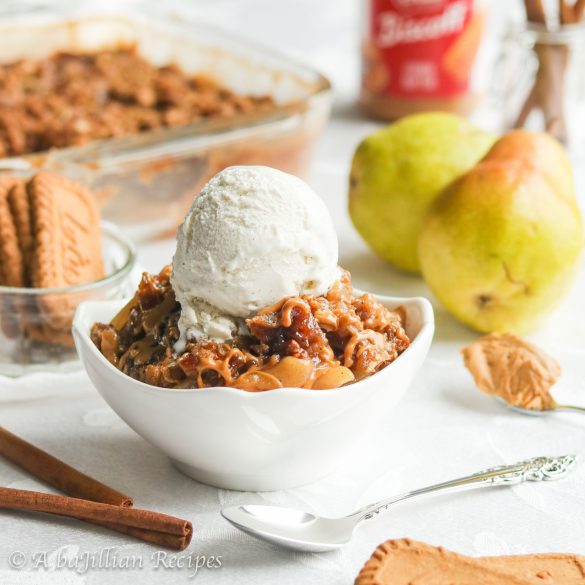 Tender and perfectly spiced pears baked underneath a luscious drizzle of cookie butter and a generous layer of toasted Biscoff crisp topping!